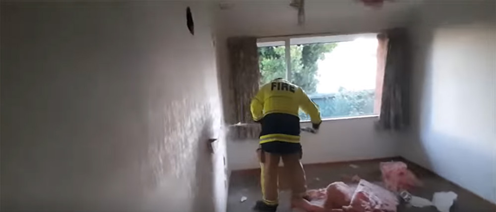 Firefighter in training at house