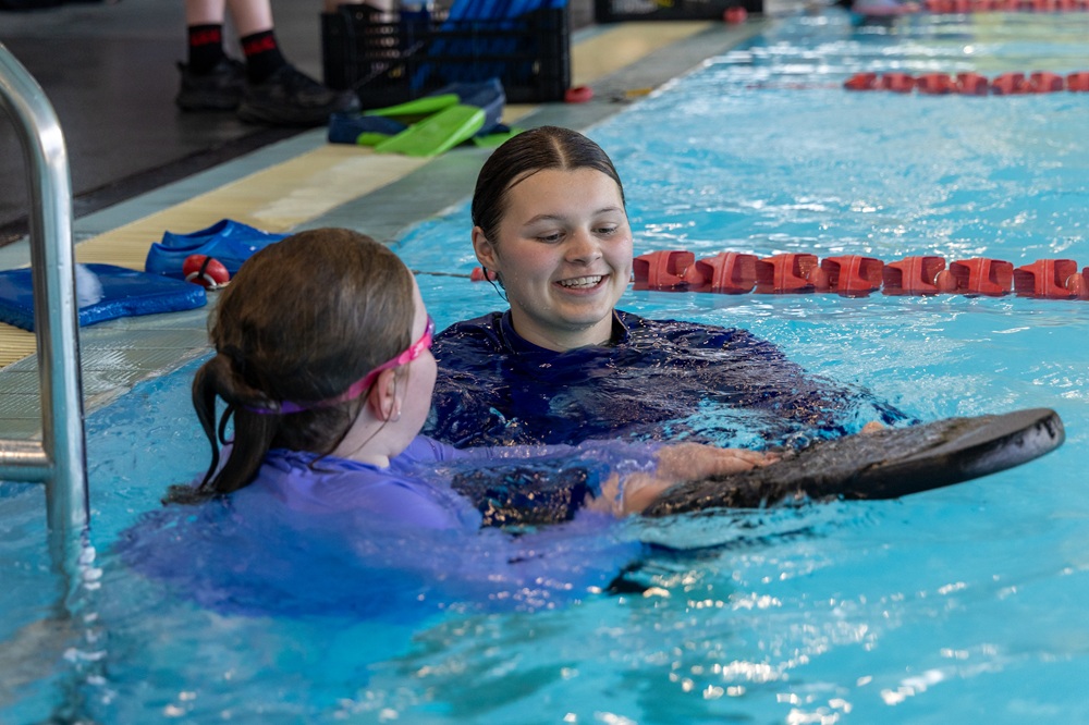 An instructor and a student in the Selwyn Aquatic Centre pool