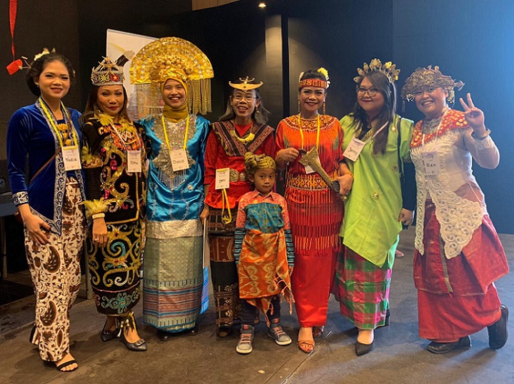 Line of Indonesian women in cultural dress preparing for CultureFest