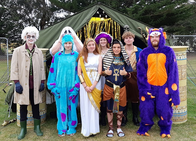 A group of teenagers in Halloween costumes