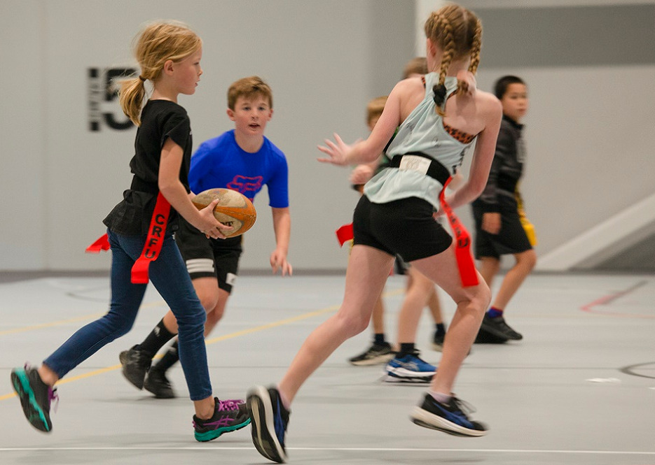 children playing ripper rugby on the hard floor courts at Selwyn Sports Centre