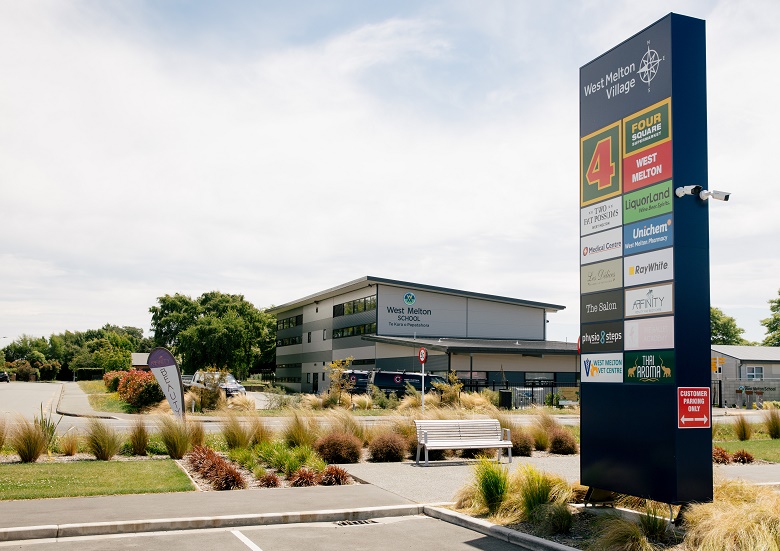 A billboard of shop signs in West Melton