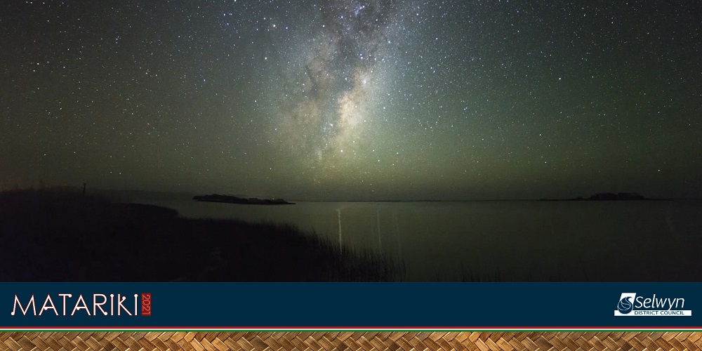 A sky full of stars over a lake with the Council Matariki logo in the corner