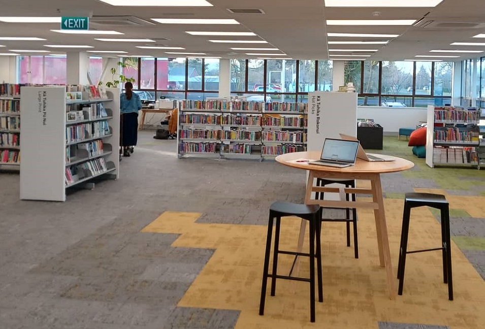 The inside of Darfield library showing a table and shelving