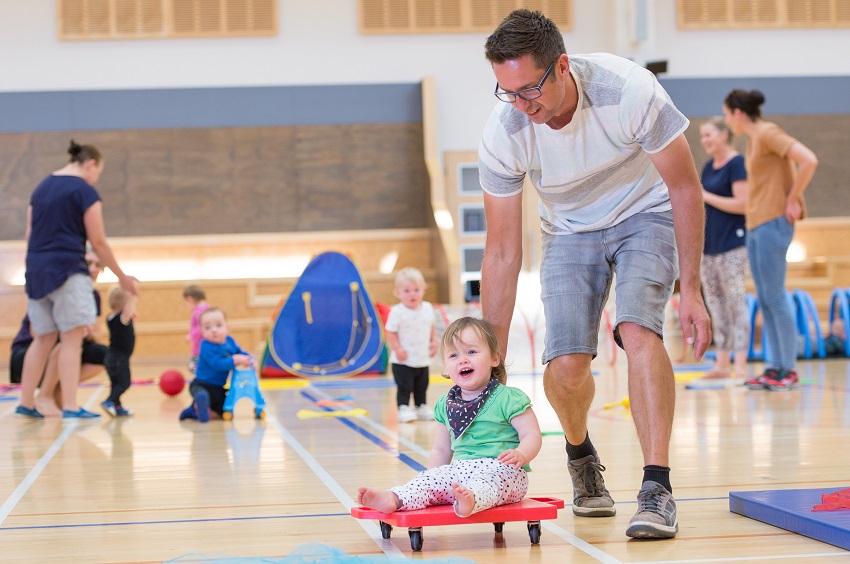 Families play at a council event centre