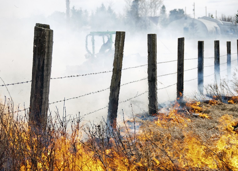 a fence line on fire