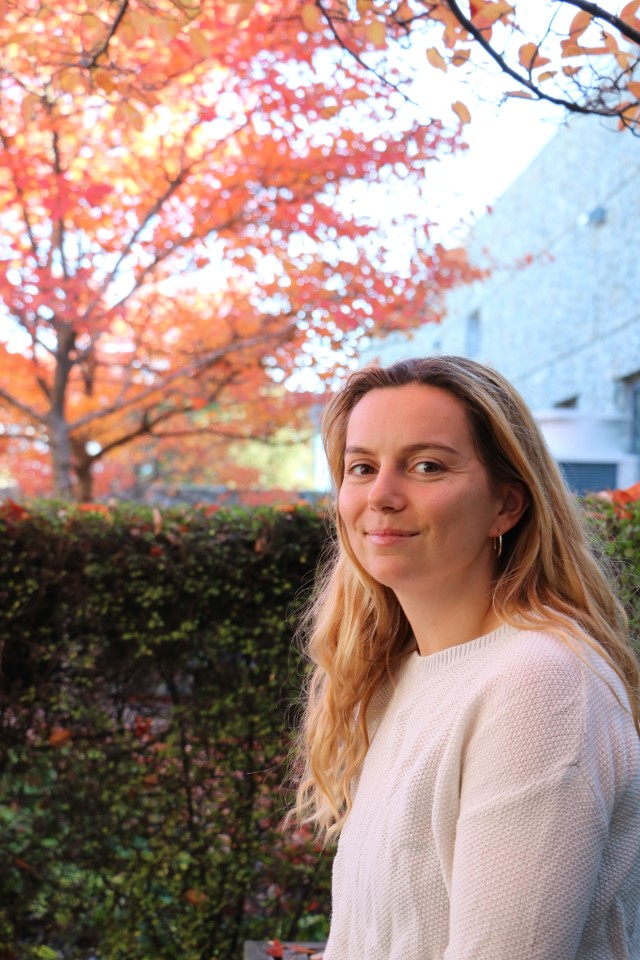 A close up photo of Clara in a garden outside the Council building