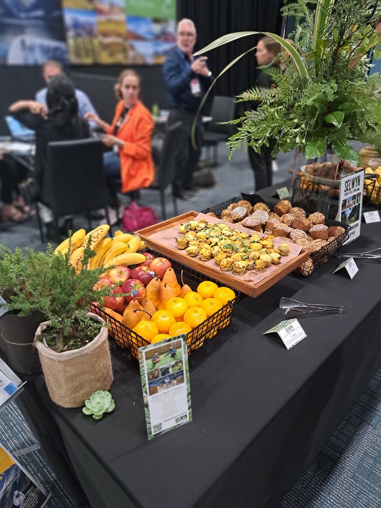 close up of a colourful table spread of food and flowers