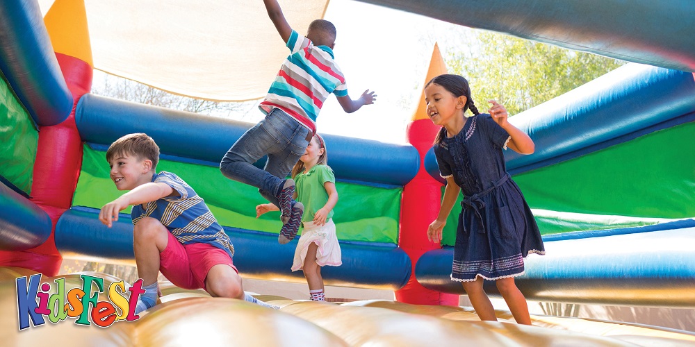 Children bouncing on a bouncy castle
