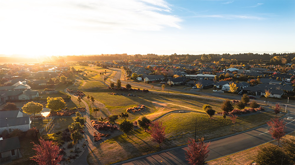 sun setting over Selwyn suburb