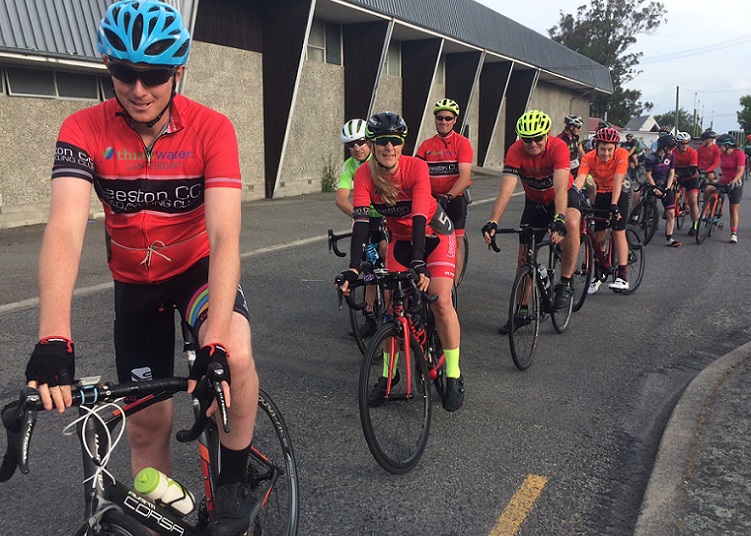 a line of cyclists in club lycra waiting to start a ride