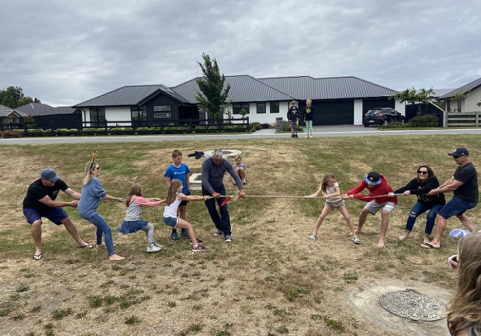 A tug of war at the annual Friends of the Woods subdivision Christmas picnic
