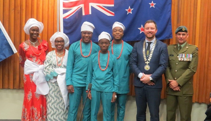 The Iposu family in traditional Nigerian dress with Mayor Sam Broughton