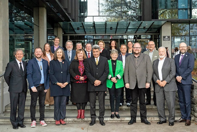 Members of the new partnership lined up together in front of the Environment Canterbury building