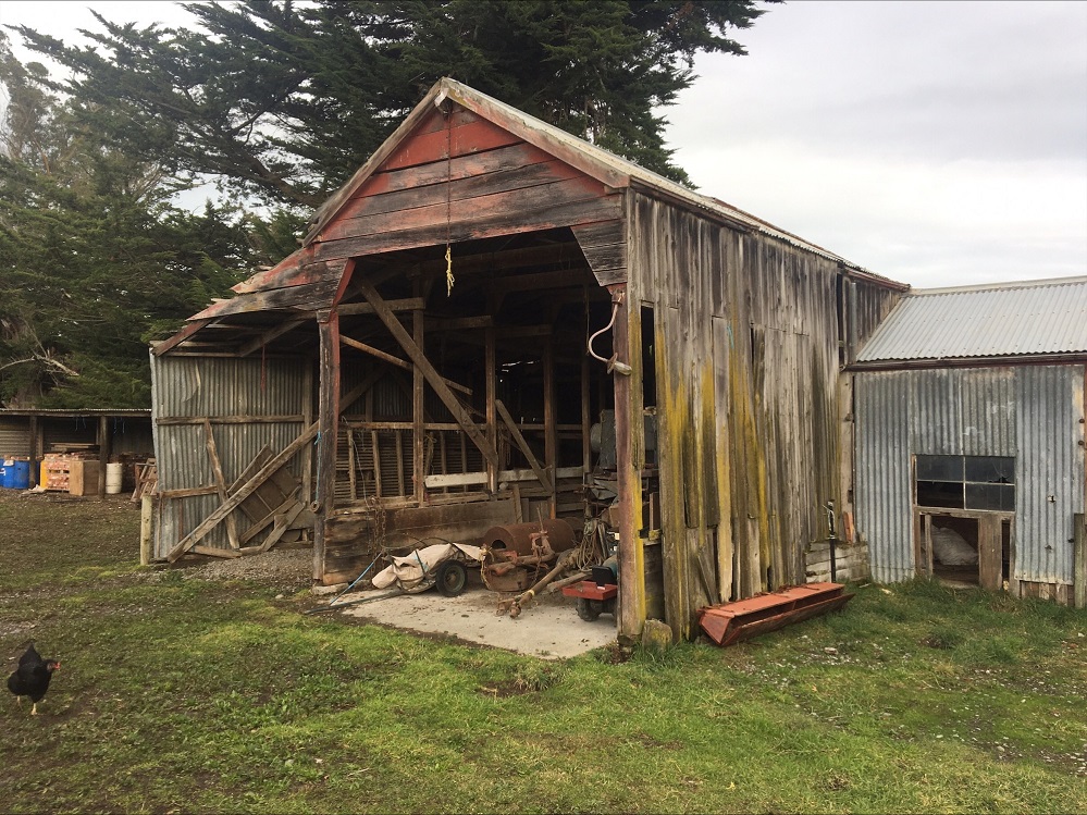 An old, broken down wooden shed