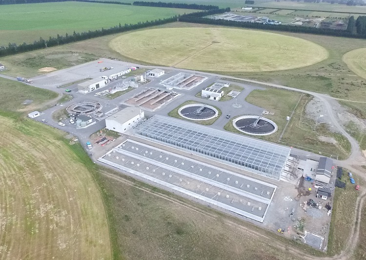 Aerial view of the Pines Wastewater treatment plant showing buildings, ponds and surrounding fields