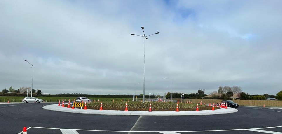 The new roundabout with cars going round it