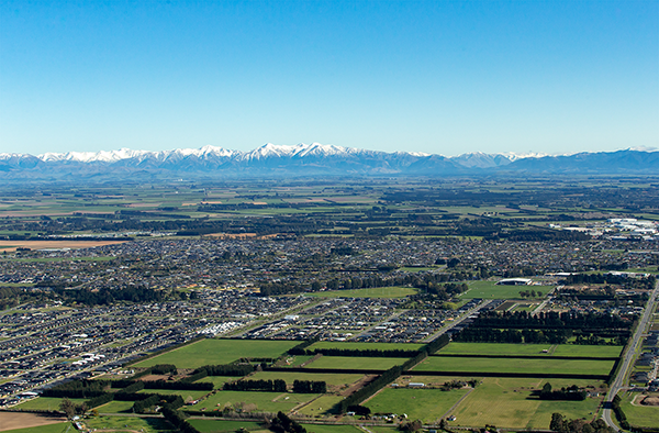 Image of houses in Selwyn and mountains in background
