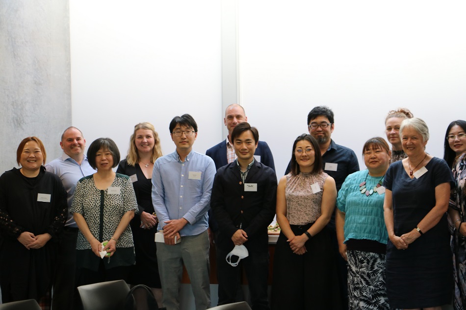 A line up of smiling event attendees