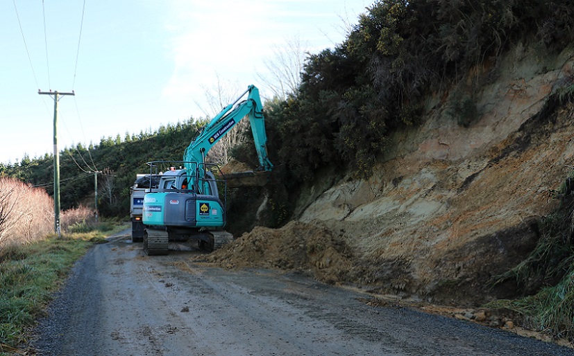 A digger clearing a slip on Malvern Hills Road