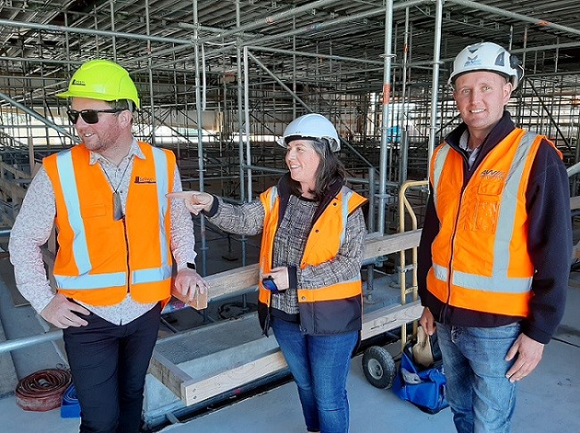Mayor Sam Broughton, Project Manager Sandrine Carrara and Site Manager Kirill Makogon inspect the construction of the Selwyn Aquatic Centre new pool. 