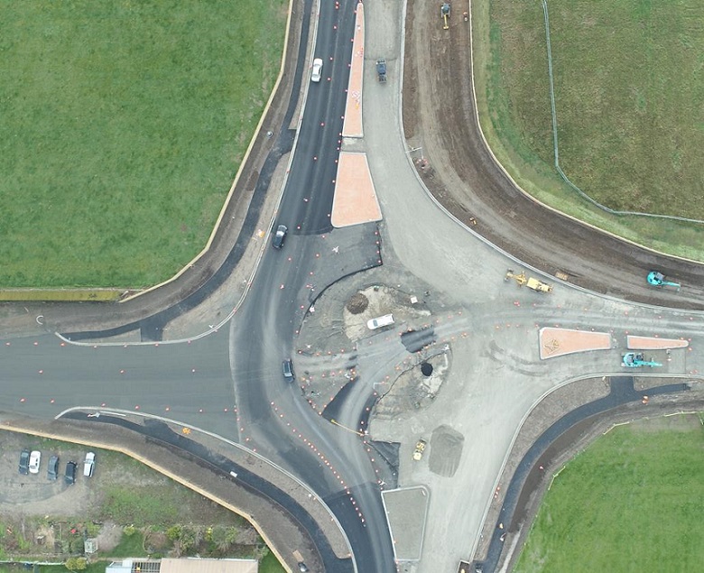 An aerial view of the partially completed roundabout showing the road layout and tarmac completed on one side
