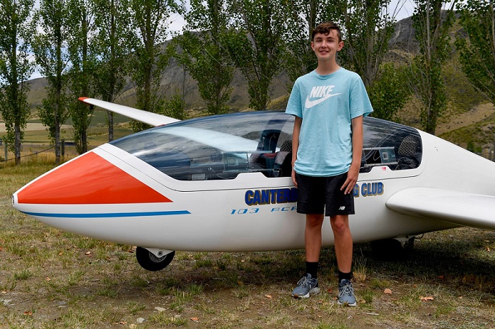 14-year-old Jack Clapham from Rolleston stands next to the Canterbury Youth Glide glider