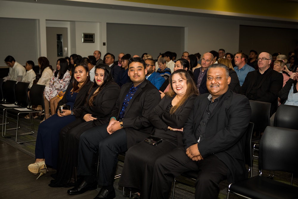 A group of new citizens and guests at the citizenship ceremony