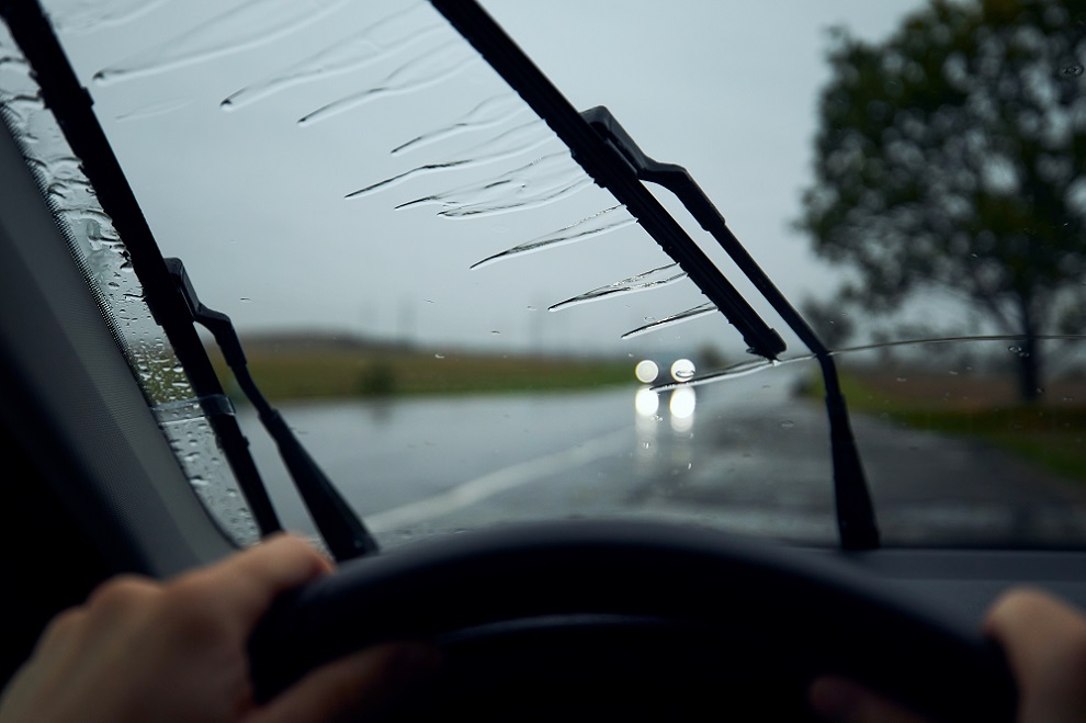 A person driving in the rain