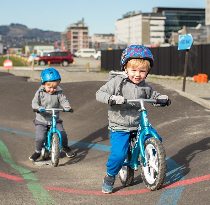 Two children using a pump track in central Christchurch