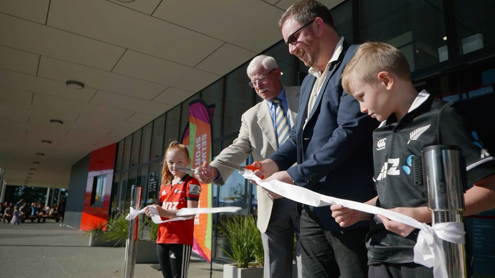 Sir Richard Hadlee, Mayor Sam Broughton and two children cut the ribbon for the opening of the Selwyn Sports Centre