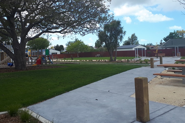 A picture of the upgraded Southbridge reserve showing picnic tables, paths and lawns