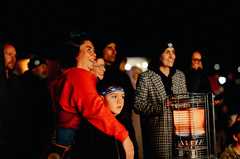 A family looking at lights for Matariki