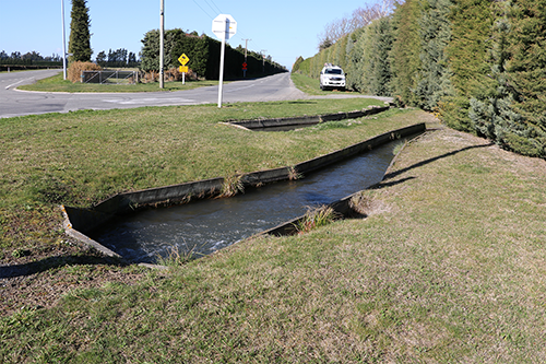 Water race beside road 