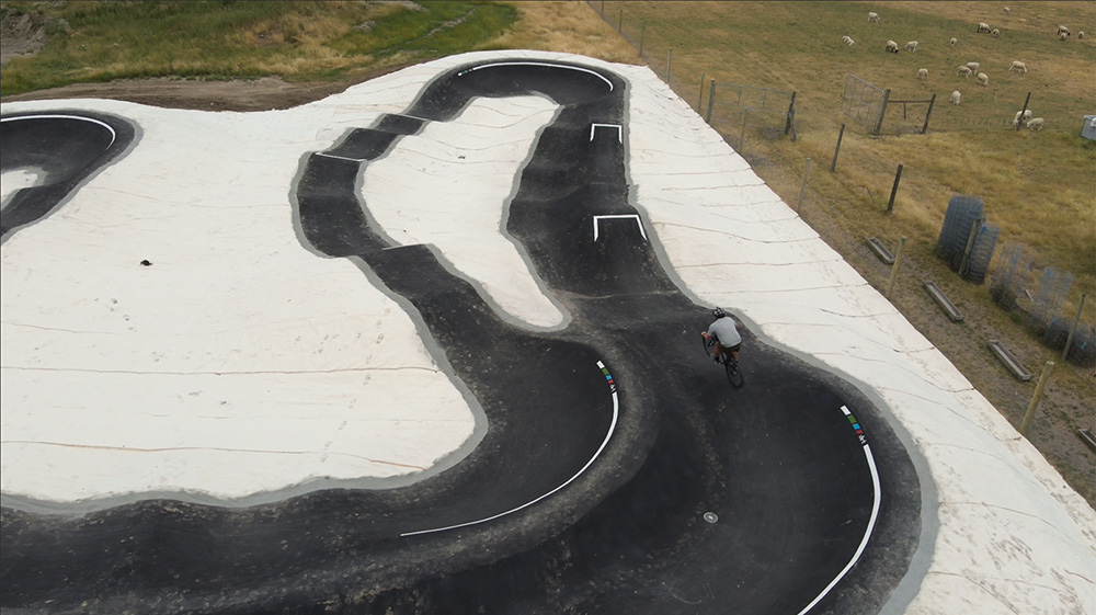 Person riding bike at bike park