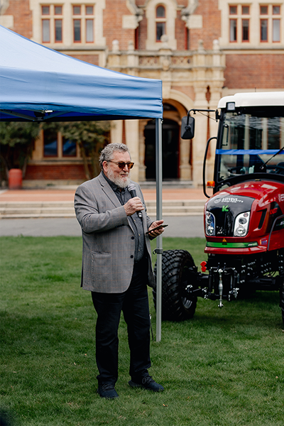Deputy Mayor talking about electric tractor next to him