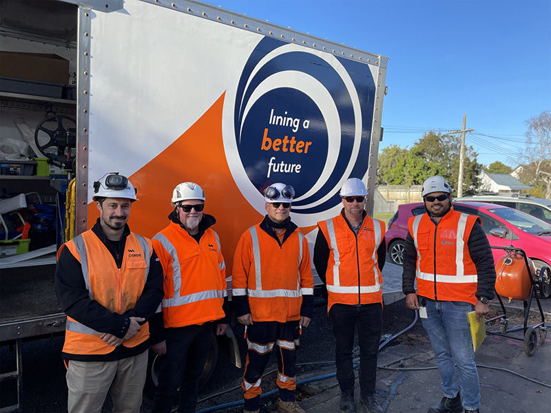 The CORDE crew standing together in front of a truck