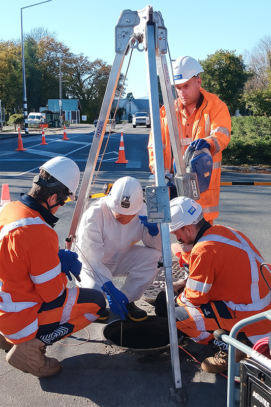 Workers working on pipes in high vis on Gerald S in Lincoln