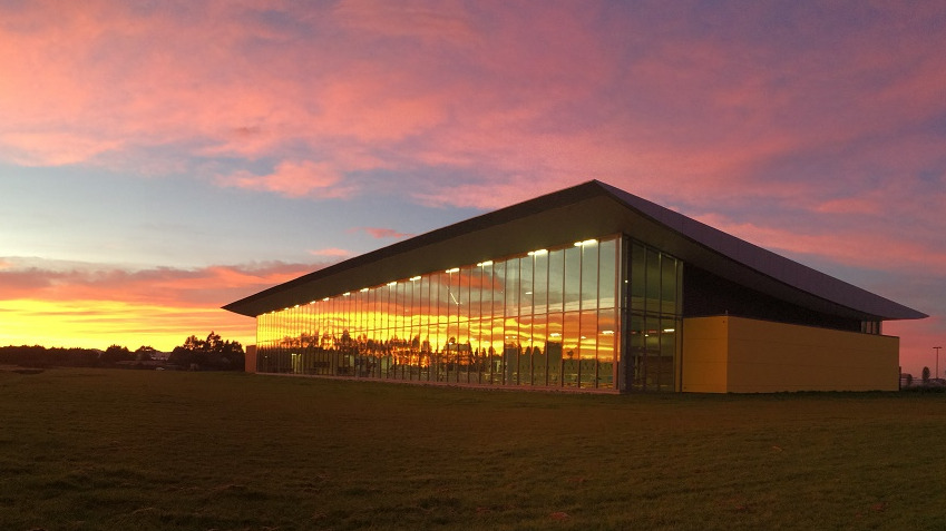 The outside of Selwyn Aquatic Centre as the sun sets