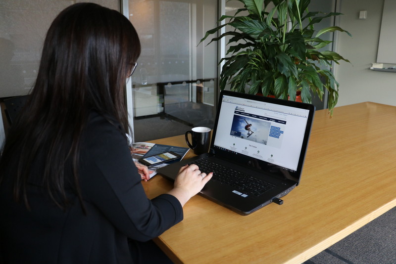 Lady at computer viewing website