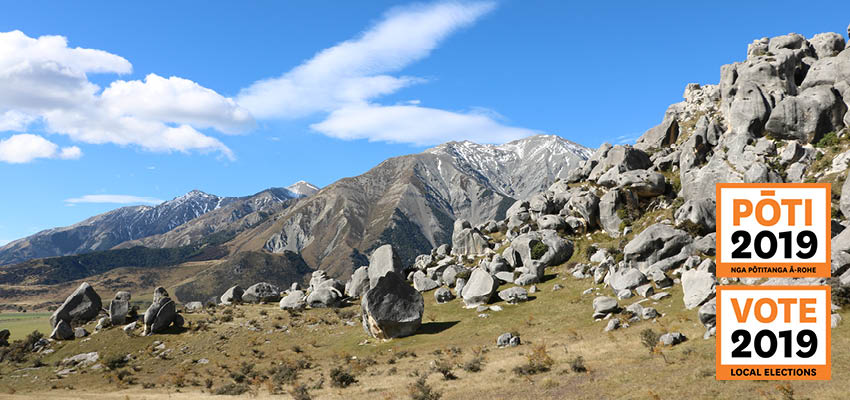 Vote 2019 logo in front of an image of rocks at Castle Hill