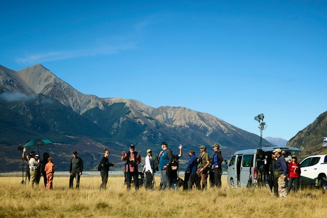 People looking over landscape 