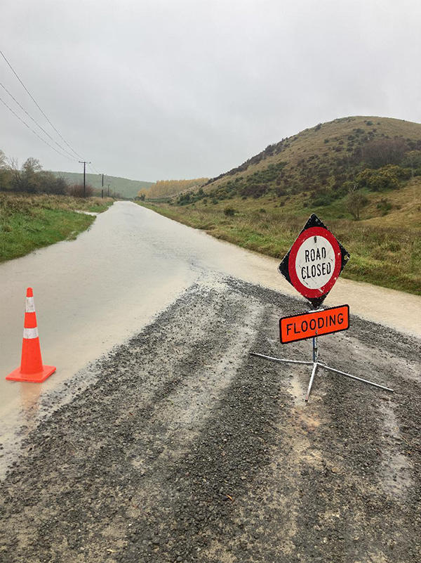 surface water flooding on road that is closed