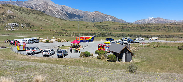 Several vehicles parked up in high country Selwyn