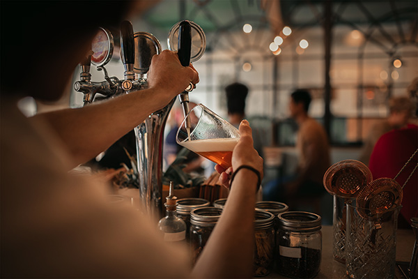 Beer being poured at bar